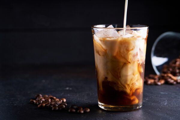 Cold ice coffee with milk in glass
