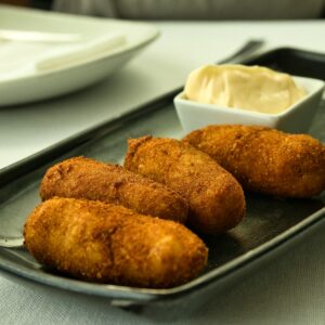 Spanish cover. Delicious gourmet croquettes stuffed with Iberian ham.Famous spanish tapa.